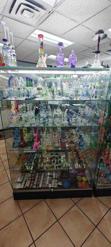 All Glass Case 48" X 72" Hight X18" Deep Frameless Black Bace Color