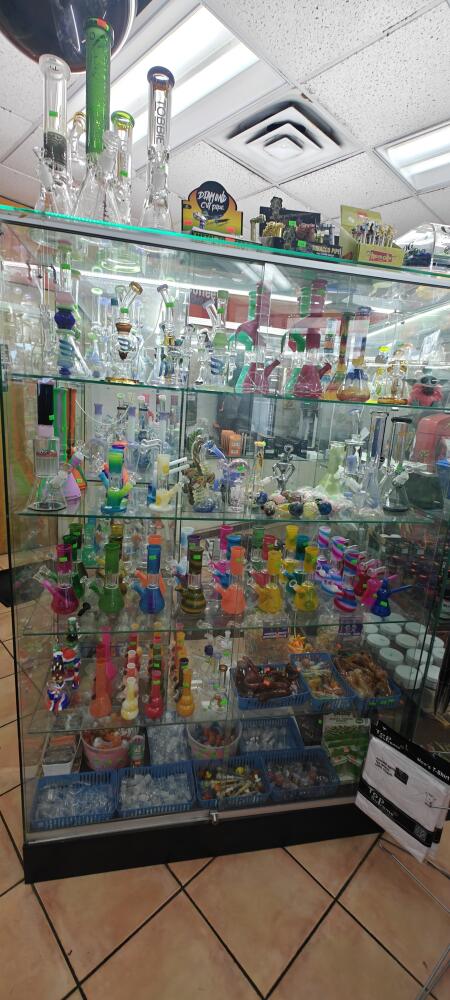 All Glass Case 48" X 72" Hight X18" Deep Frameless Black Bace Color